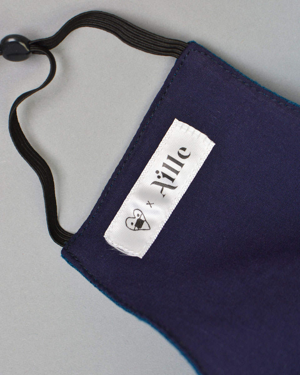 Inside of the blue face mask with the Aille label. 