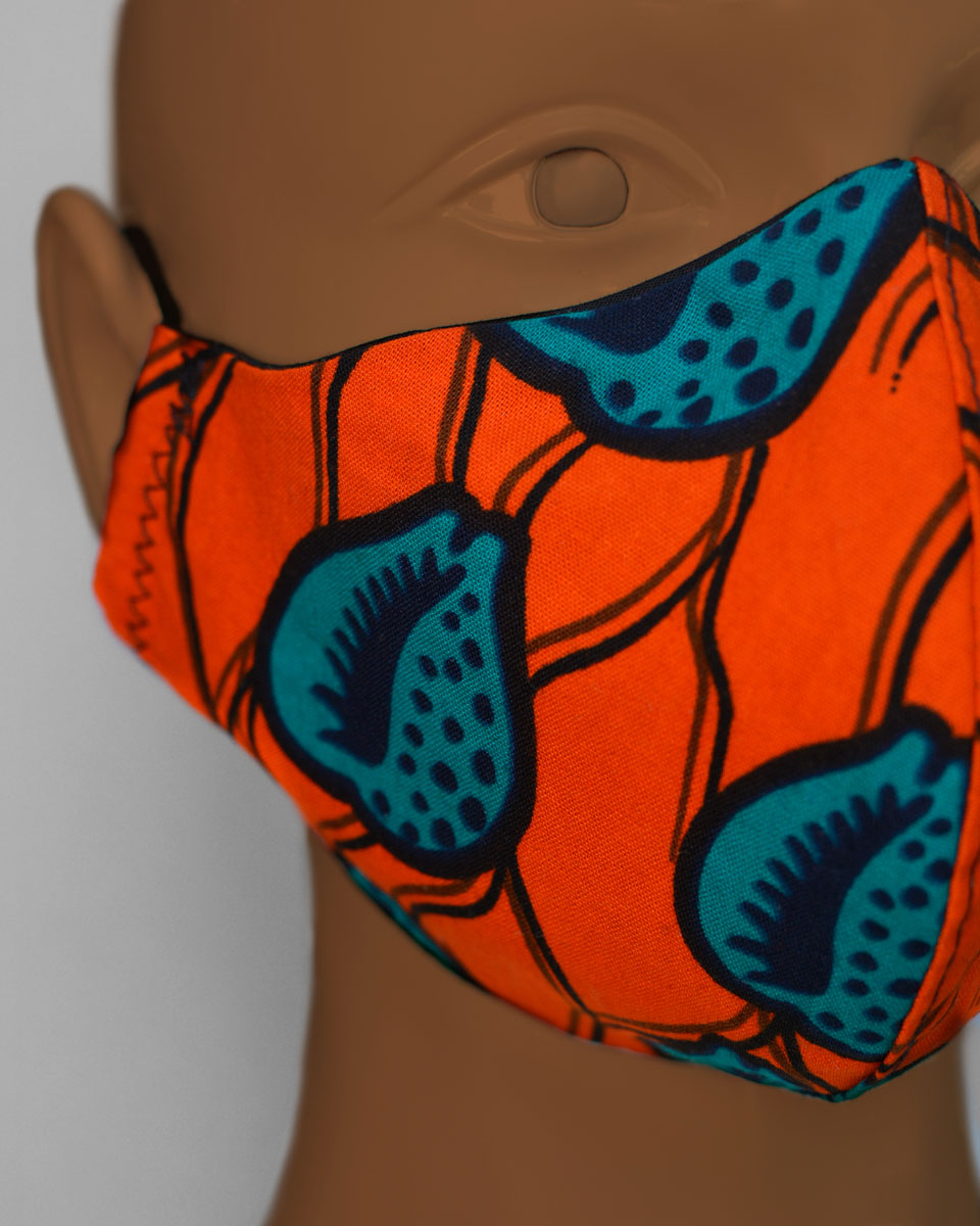Detail shot of orange face mask with a blue and black pattern