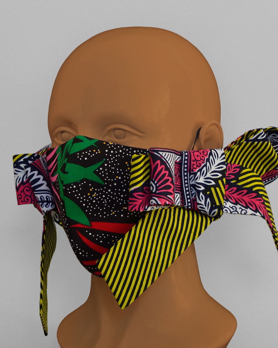 Side view of the colourful floral and striped bowtie face mask