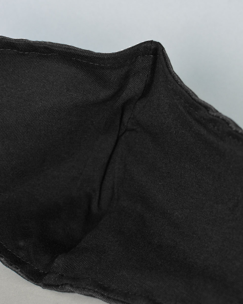 Inside of mask with black lining and a nose wire