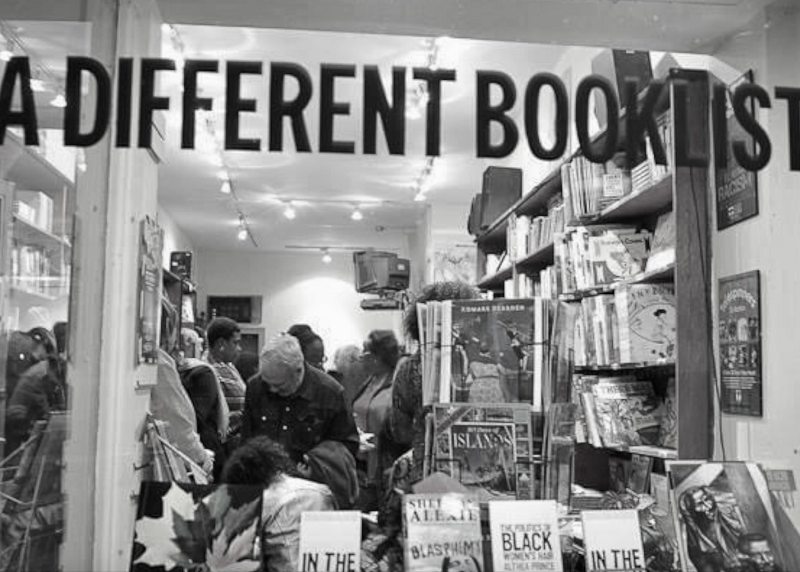 Exterior shot of a bookstore. Customers can be seen inside through the windows.
