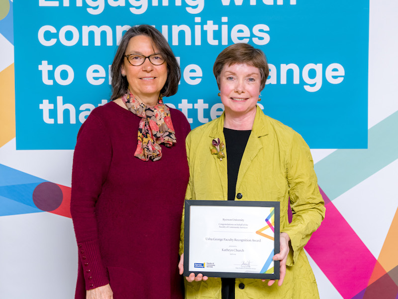 Jennifer Martin and Kathryn Church at an awards ceremony