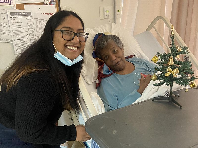 Student Roshana and resident Elferna pose together