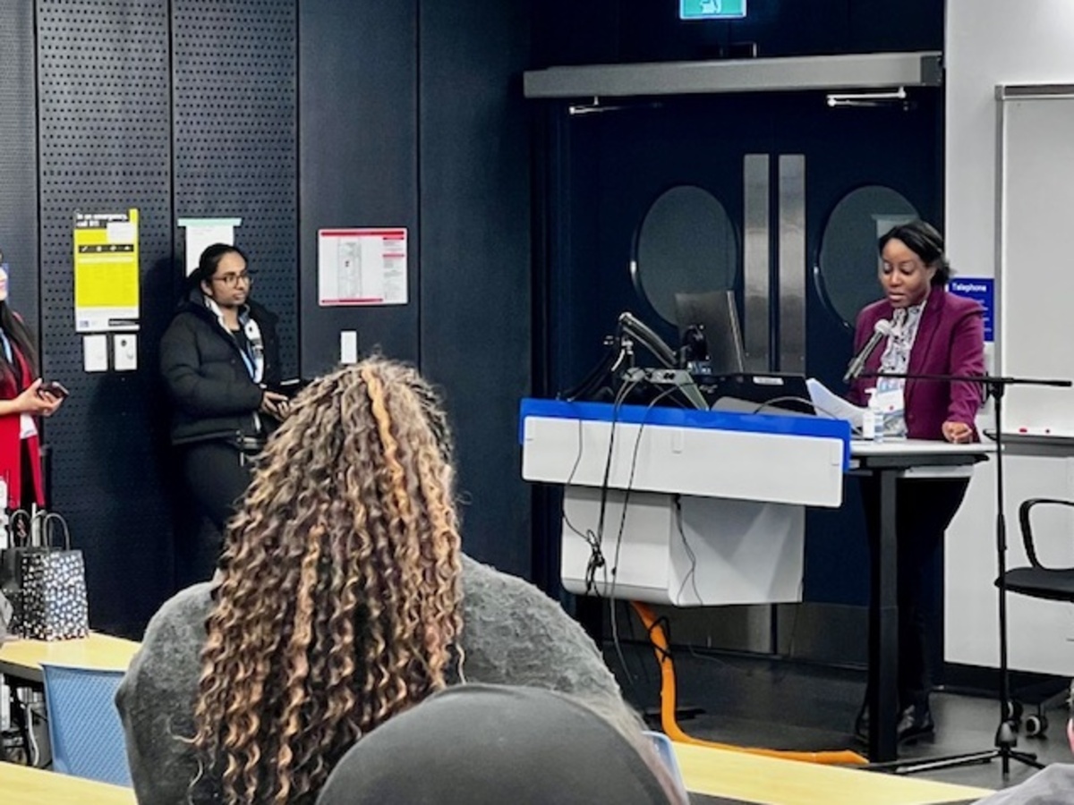 Black woman presents at the Enhancing Equity in Ontario Elementary Education Symposium