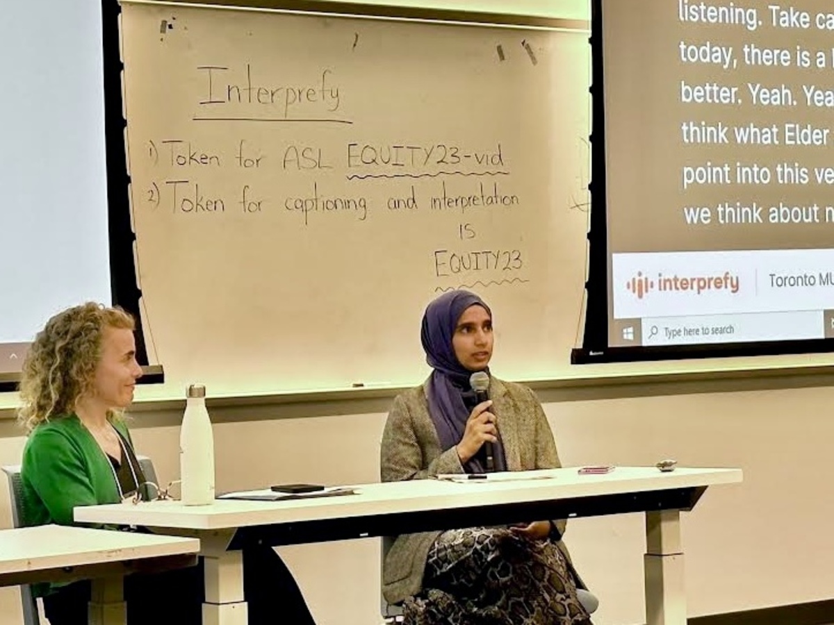 Two female panellists, one in a hijab, speak at the Enhancing Equity in Ontario Elementary Education Symposium