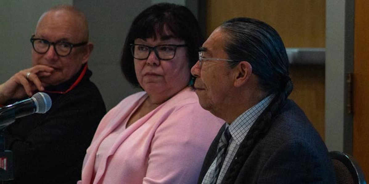 Indigenous faculty members addressing a conference