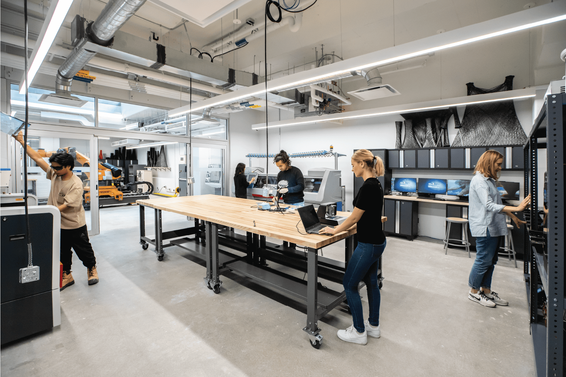 Students working at desks and workbenches in the Design and Technology Lab