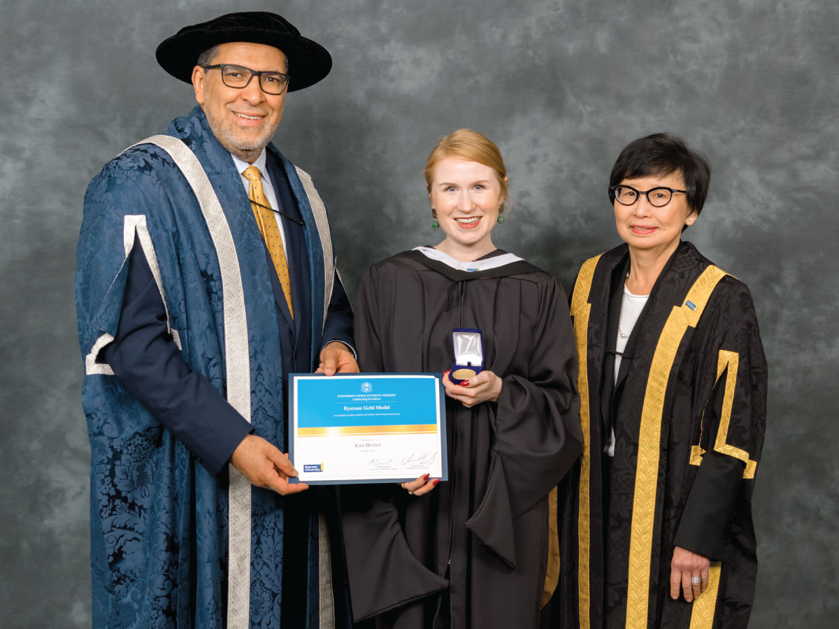 Kira Brown with university President Mohamed Lachemi and Chancellor Janice Fukakusa.