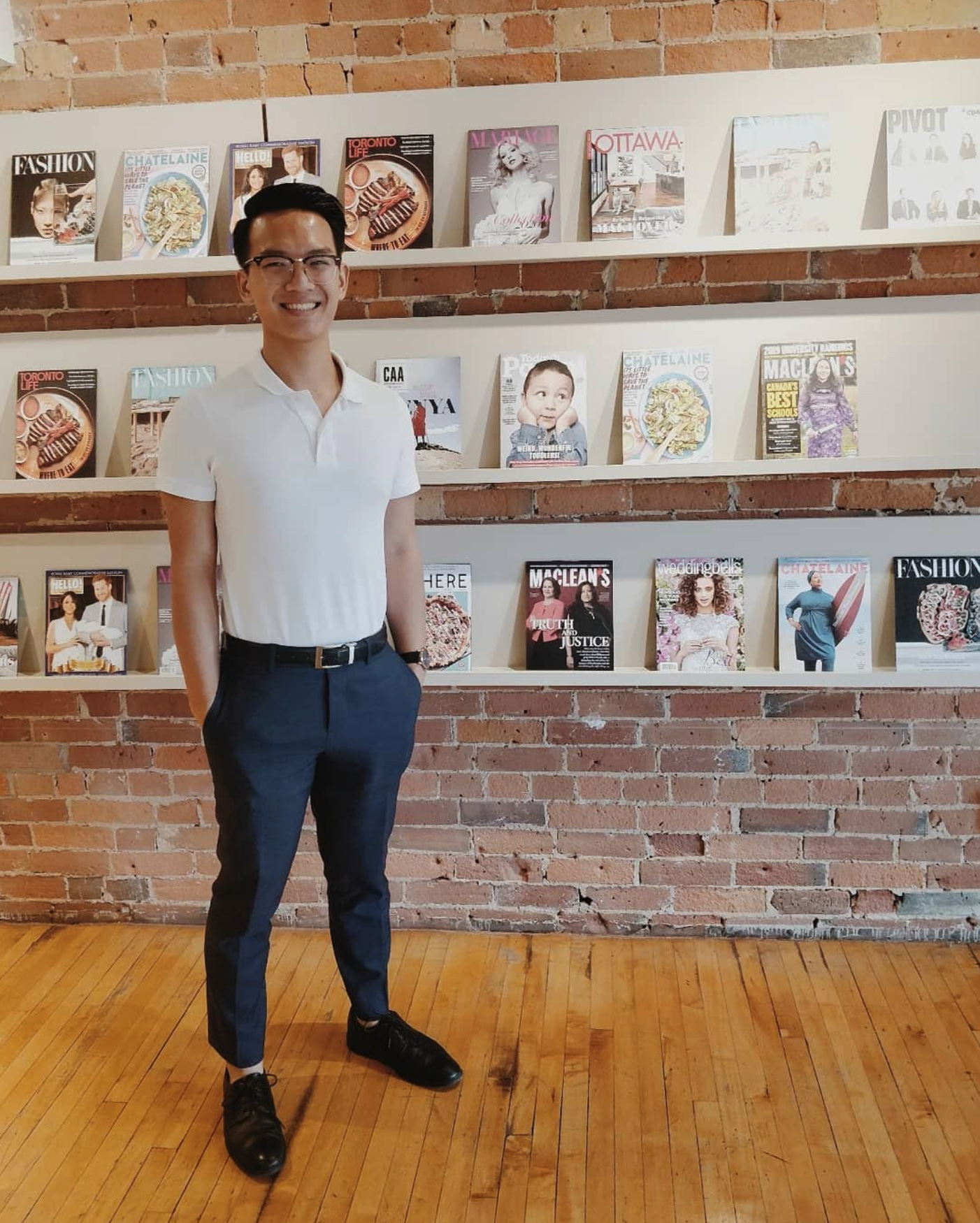 A student smiling at their internship placement, a magazine publisher