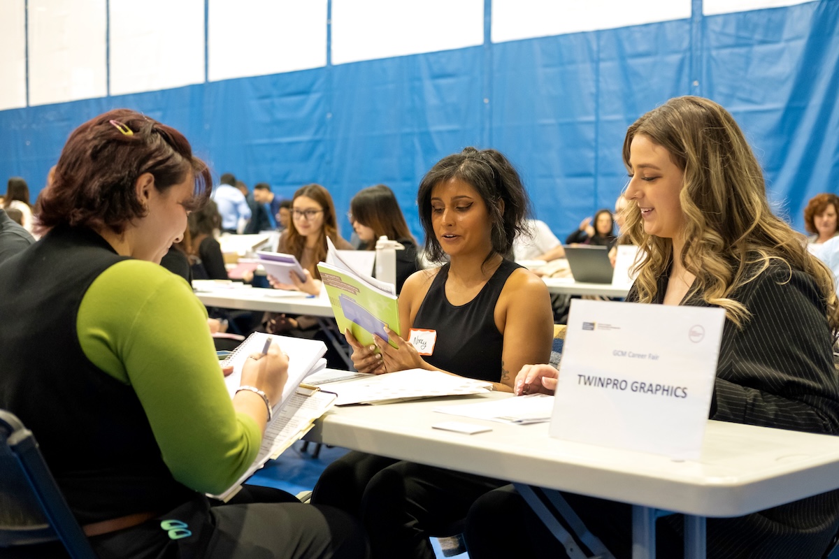 Photo of students and employers at GCM Career Fair