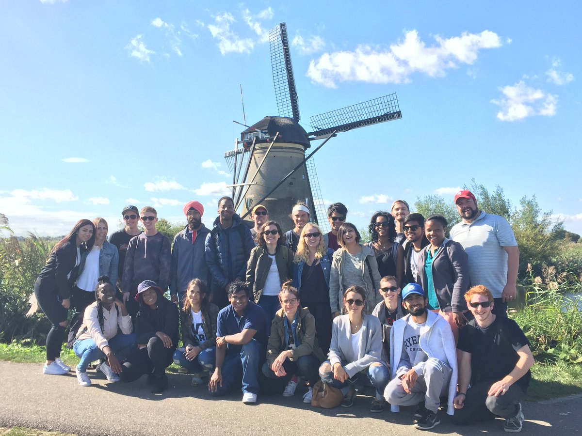 Geographic Analysis student group in front of windmill on Netherlands field trip