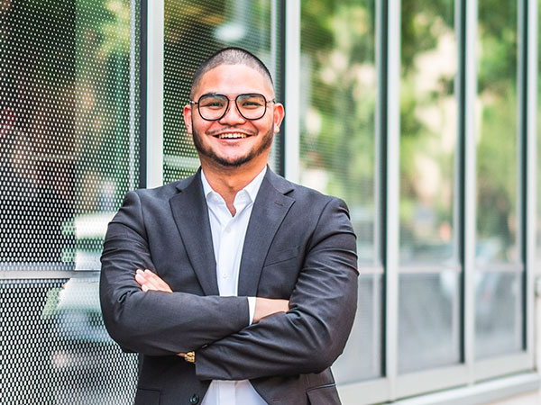 Marc Castillo standing in outdoors in the Ryerson University Campus