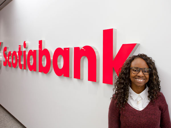 Deborah Mepaiyeda, fourth year co-op student in Computer Science, stands in the Scotiabank Plaza in downtown Toronto. Photo by: Ryan Churchill.