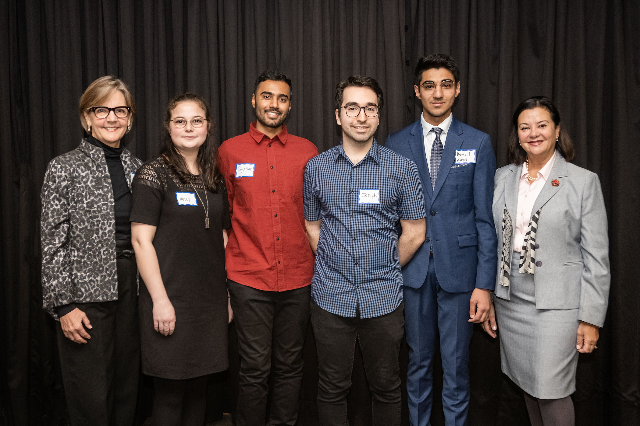 Recipients of the LIFE Institute Student Awards stand with Virginia Bosomworth, president, The LIFE Institute (left) and Dr. Marie Bountrogianni, dean, The G. Raymond Chang School of Continuing Education (right). Photo by Jae Yang.