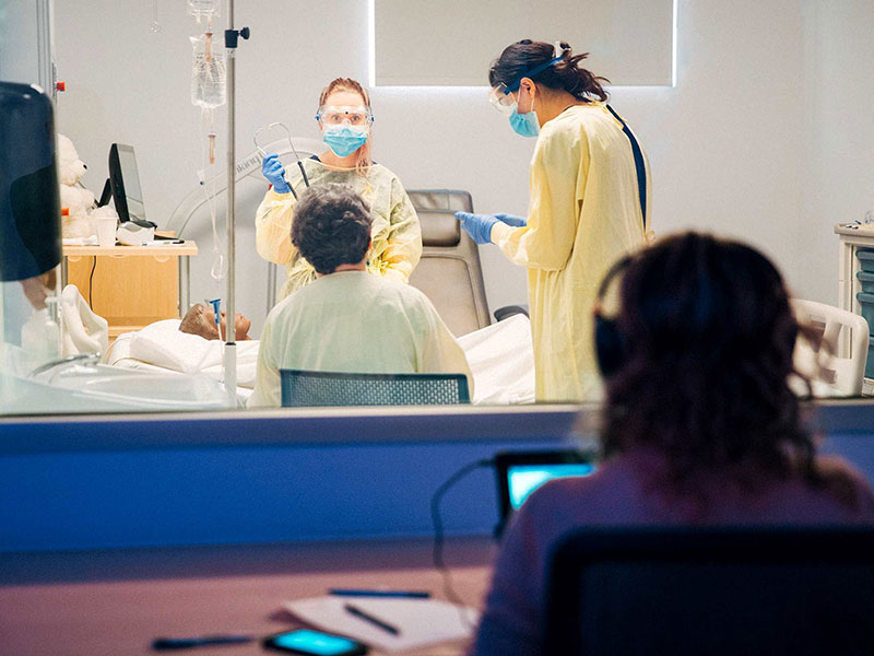 Students work with high-tech mannequins that talk, move and respond to light. This helps improve patient care and confidence. Photo by Ryan Walker.