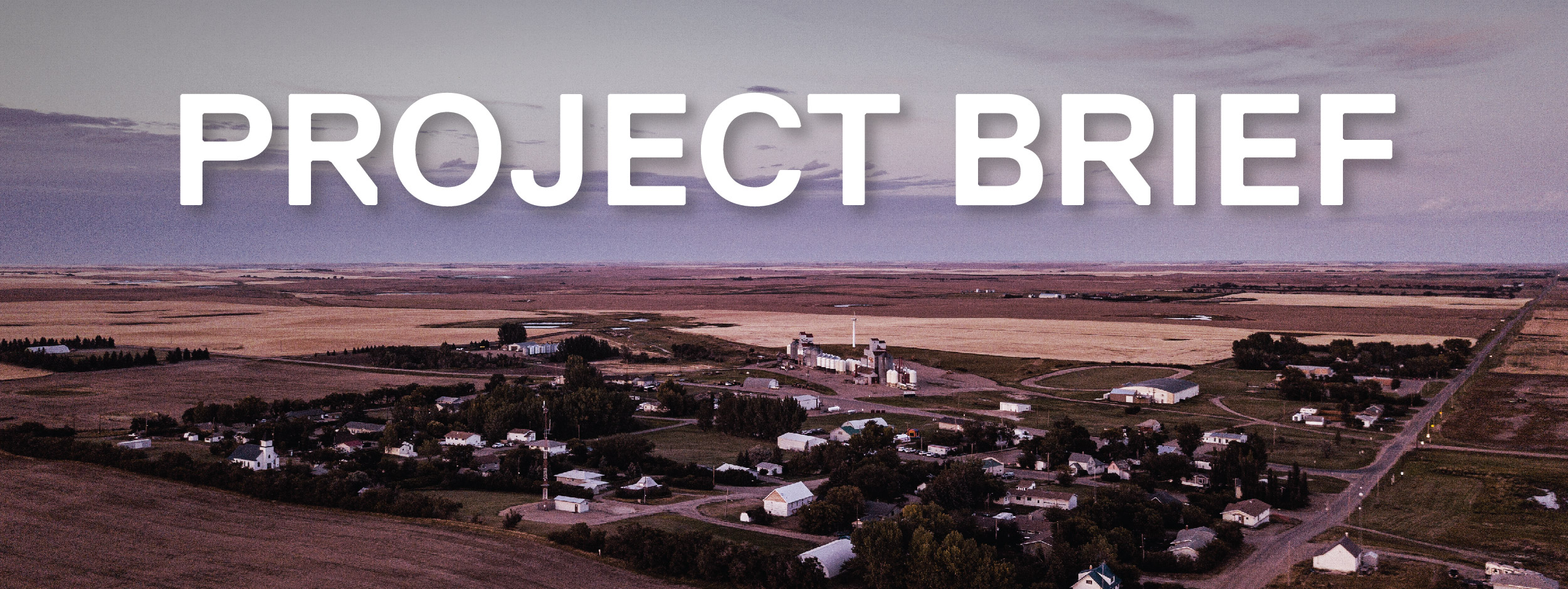 Aerial of village with houses and fields in Saskatchewan
