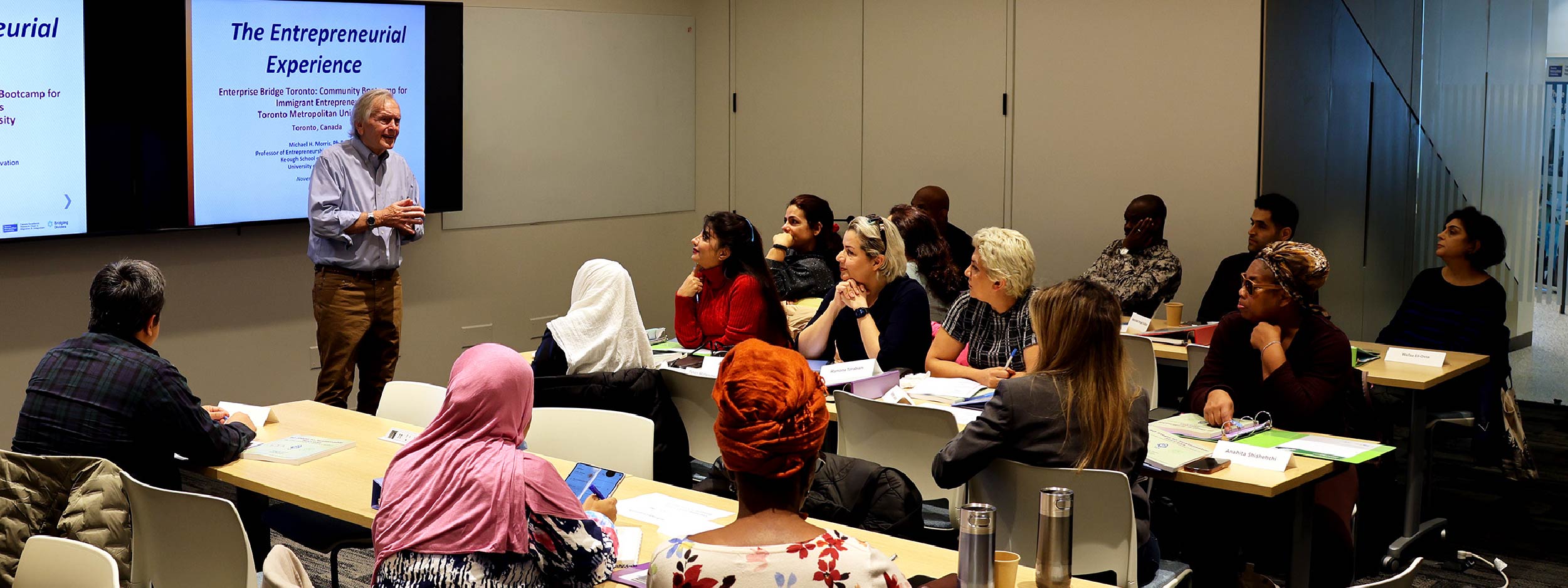 Dr. Michael Morris presents to a room of participants