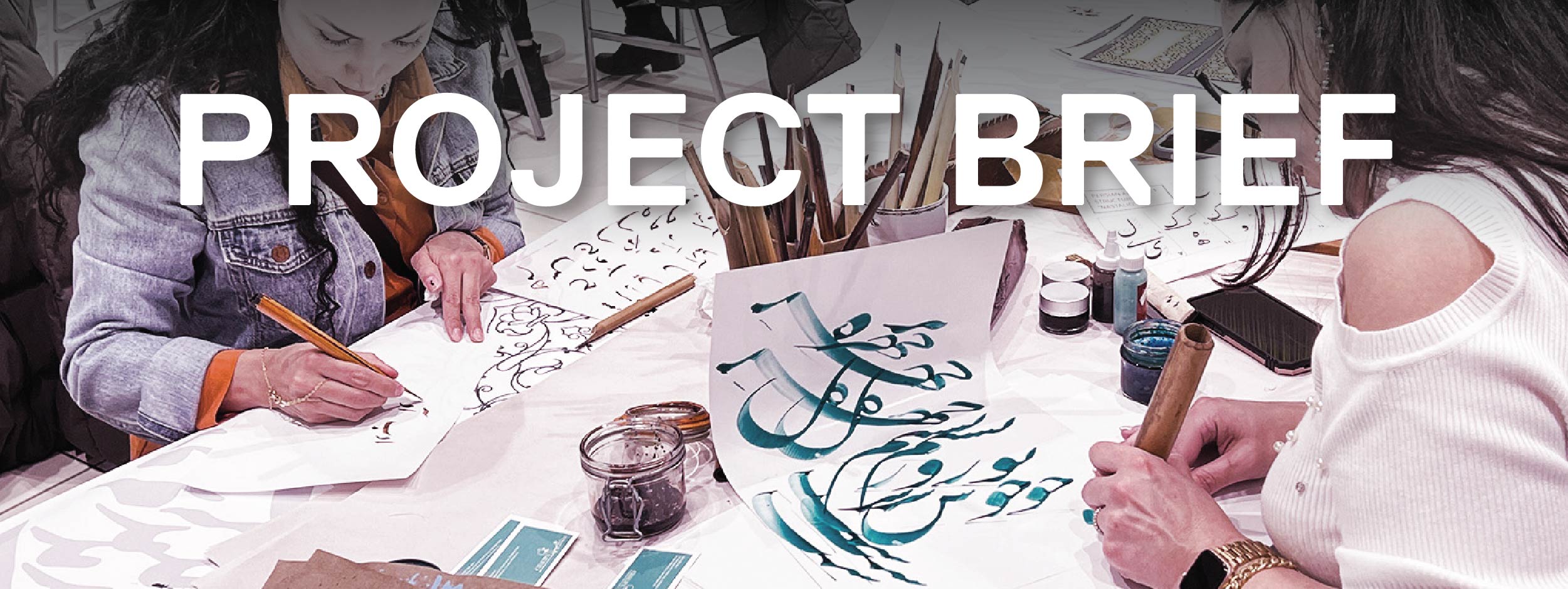 Two women writing in a Farsi calligraphy workshop