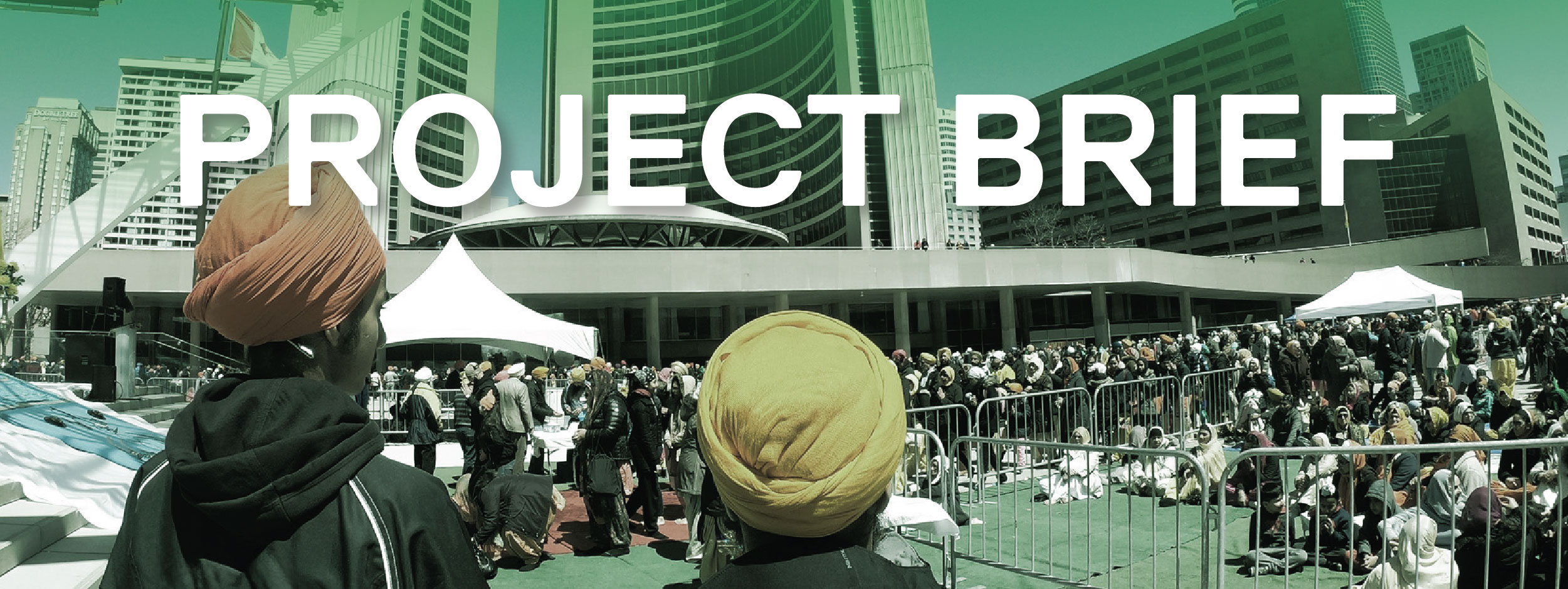 Two Sikh men standing at a public event at Nathan Phillips Square, Toronto