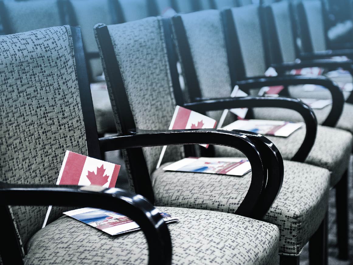 Canada flag and pamphlet on chair