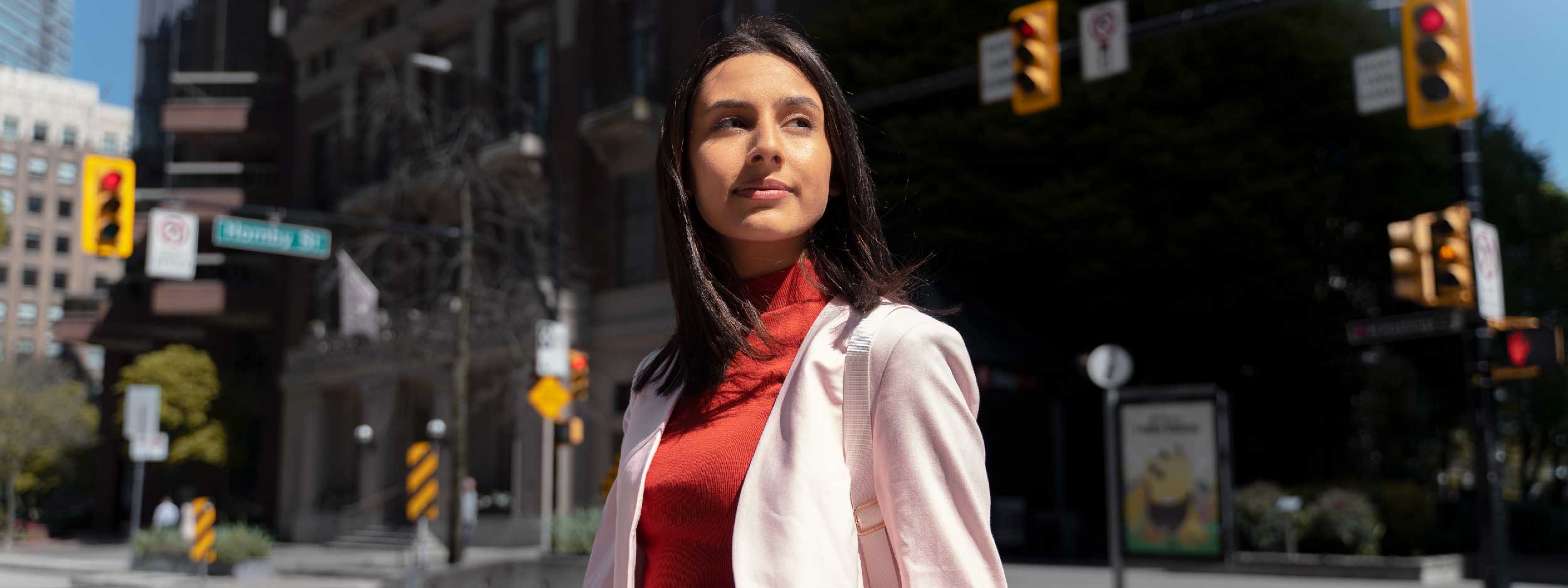 Young woman standing in a city downtown