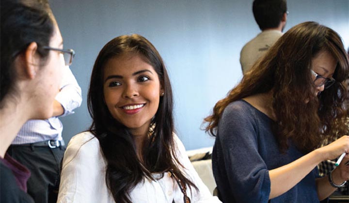 Students talking at a networking event