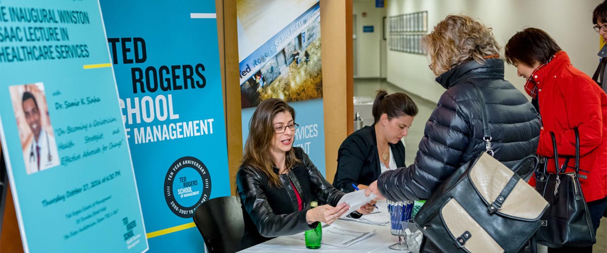 Students registering for the annual health services management lecture