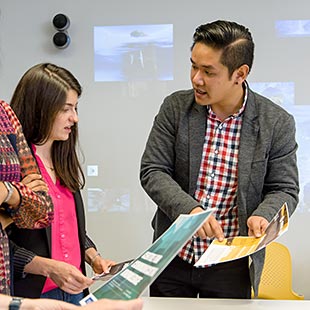 Jacky Au Duong with fellow graduate student in classroom