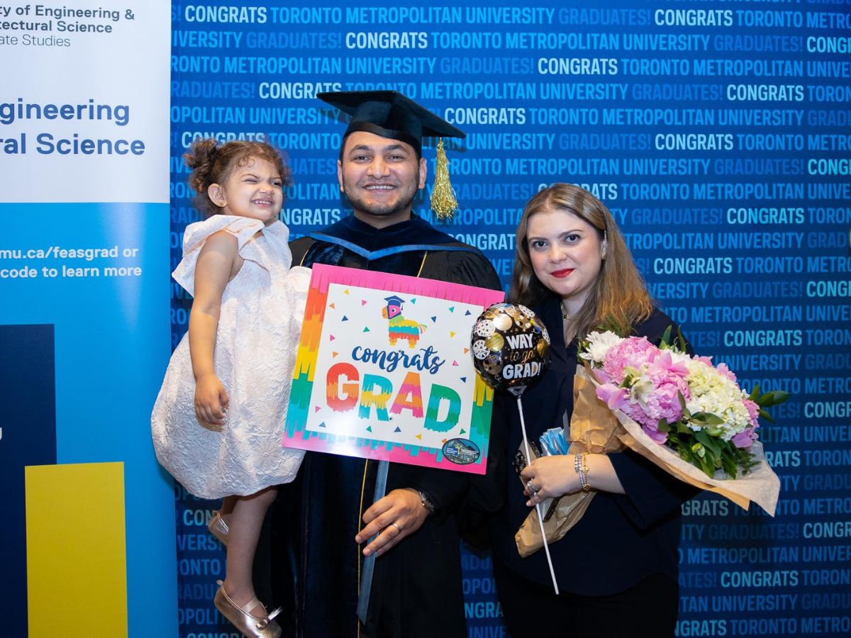 Dr. Ahmed Diab celebrates his graduation with his wife Rose and their daughter Leyla.