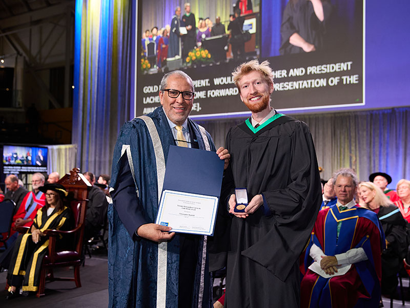 Christopher Randall and President Mohamed Lachemi at convocation