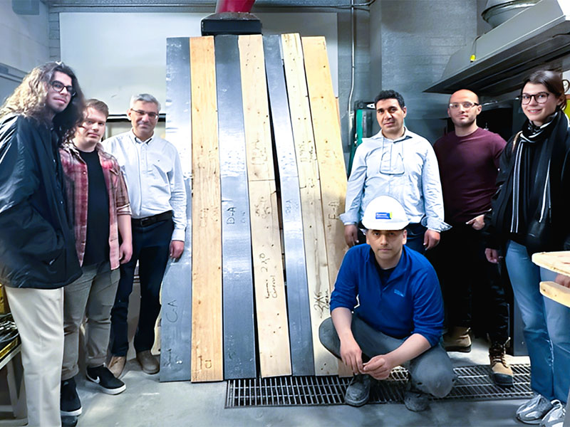 Obaid Mahmoodi with Dr. Hocine Siad and industry partners in the Civil Engineering Structures Lab