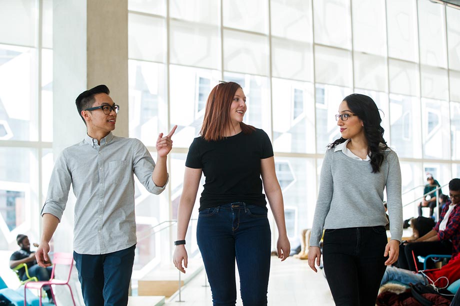 Three students walk together