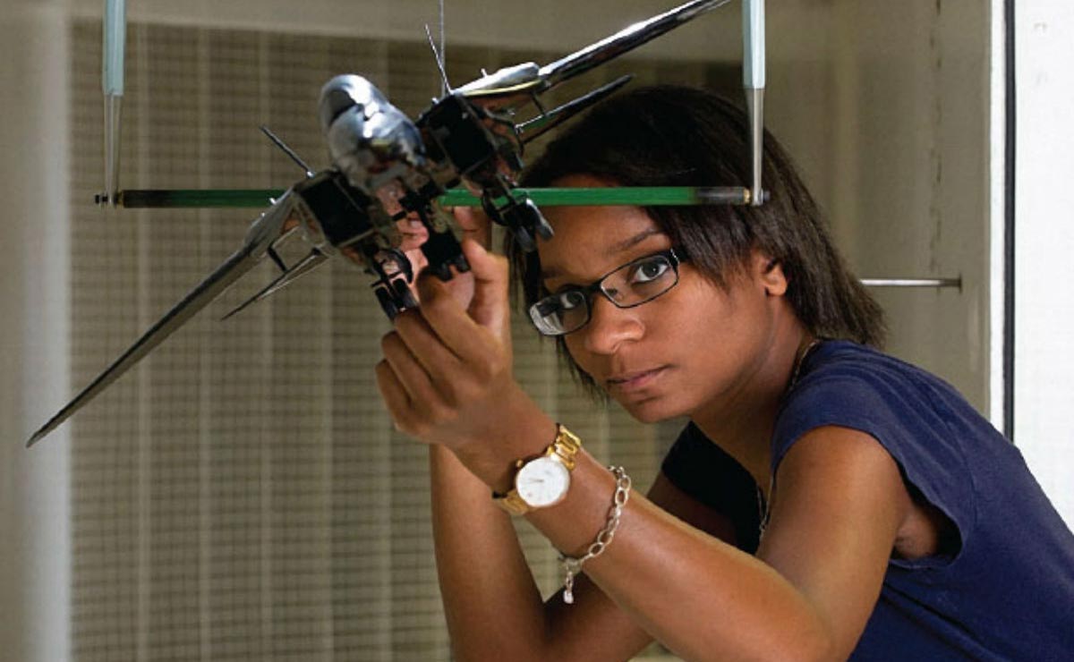 Aerospace Engineering graduate student with model aeroplane