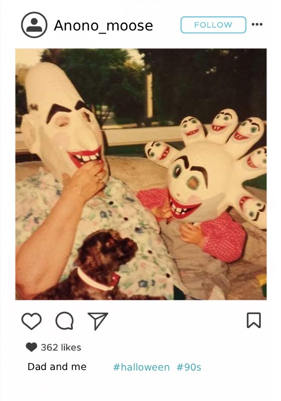 A digitized analog image of a father holding his young son and small dog. The father and son are wearing home made Halloween masks. The masks depict broad, smiling faces.