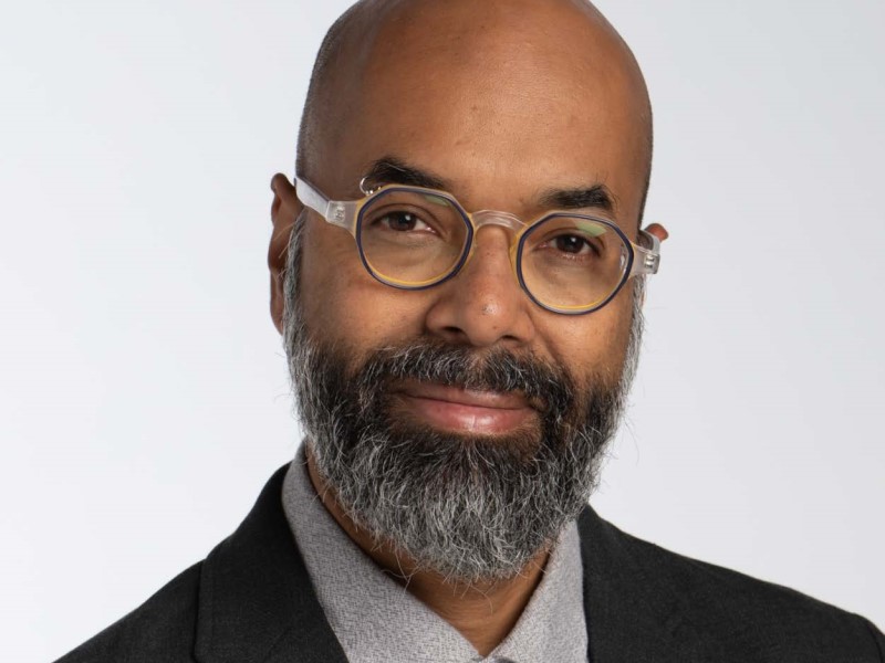 Portrait of RTA Media Professor Richard Lachman wearing glasses and smiling