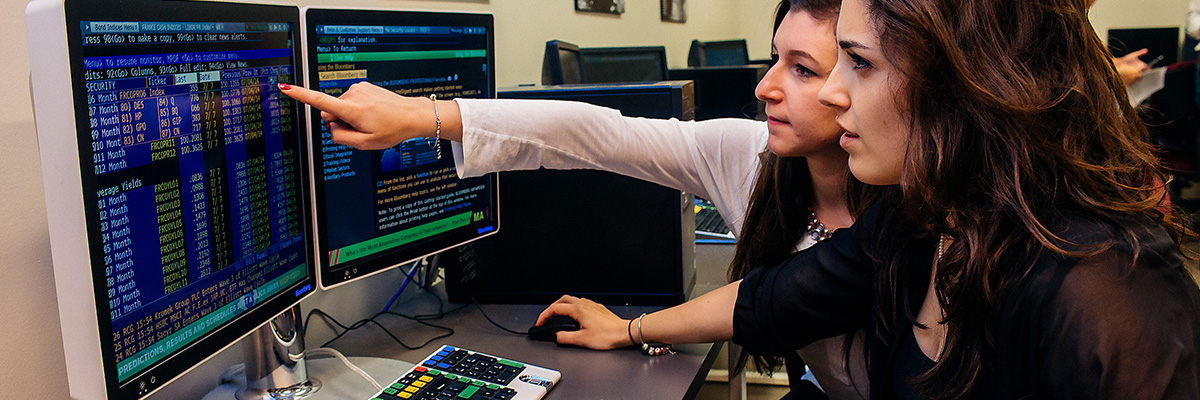 Two students working on a computer