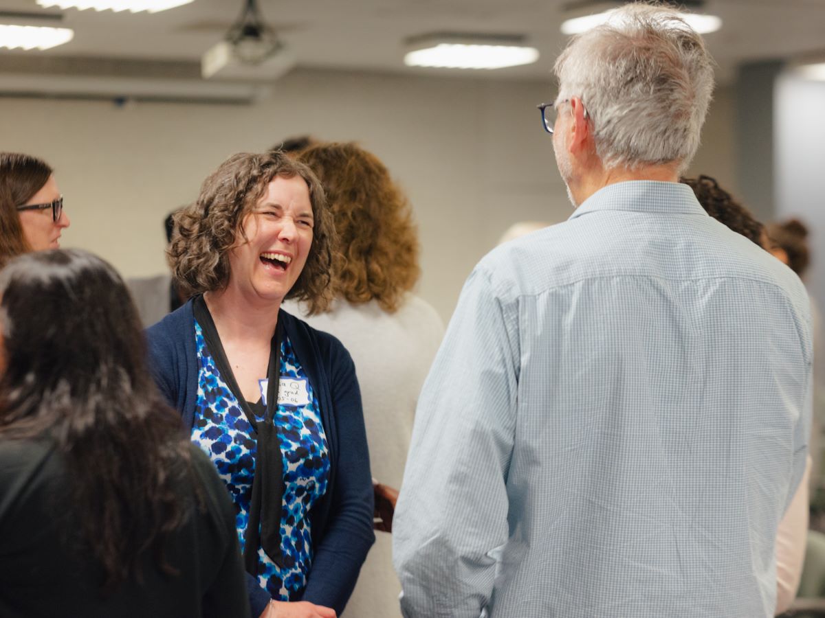 Faculty and alumni talking