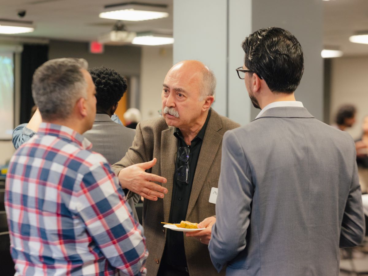 Faculty and alumni talking