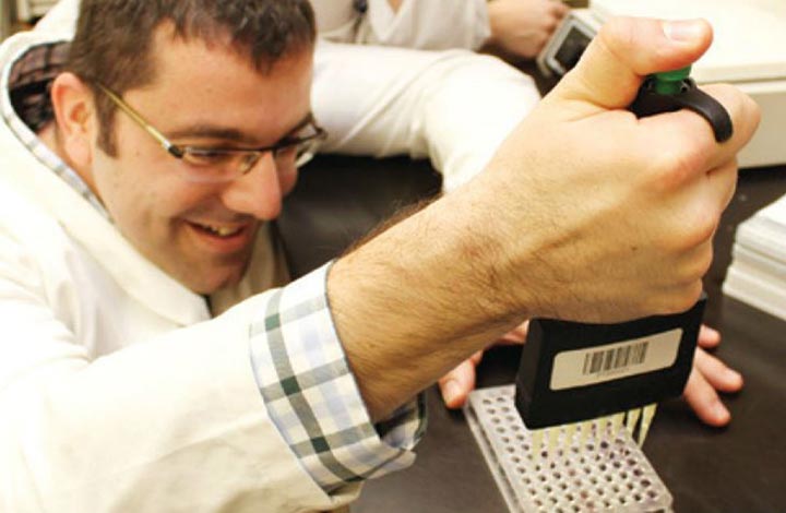 Molecular Science student testing samples in lab environment