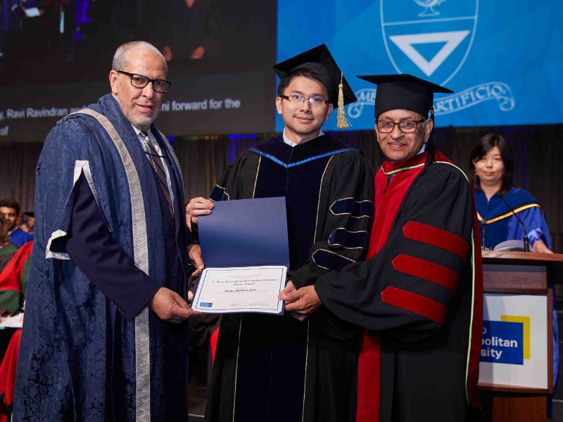 Dr. Parky Lau receives Outstanding Doctoral Thesis award on stage at convocation