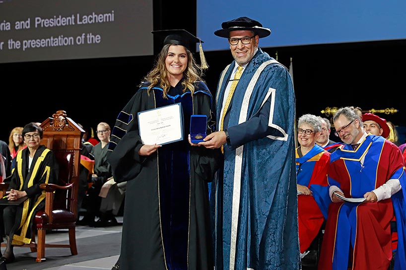 Dr. Victoria Emily Barbosa Hipolito (left) and President Lachemi