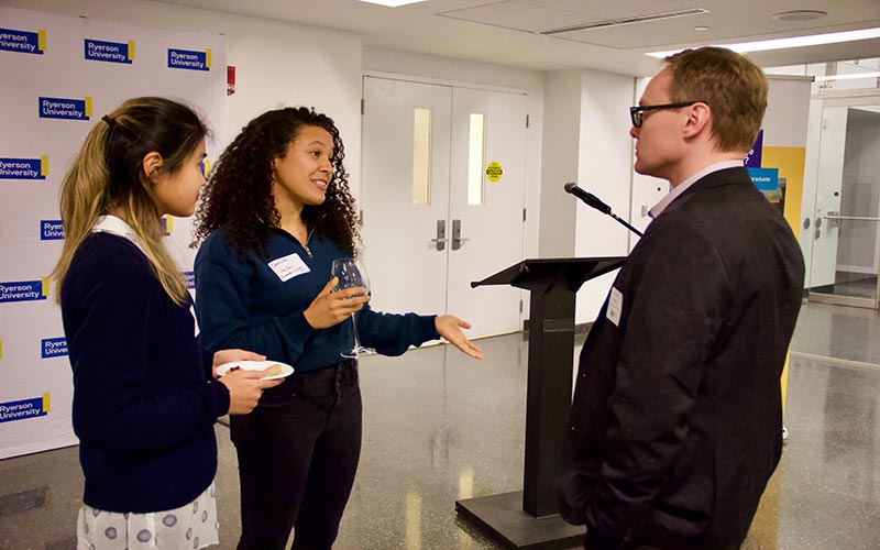 Graduate students speak with vice-provost and dean Dr. Cory Searcy