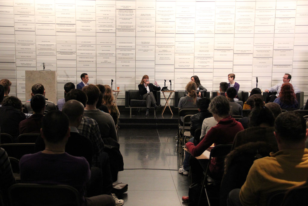 Panel in discussion in Sears Atrium