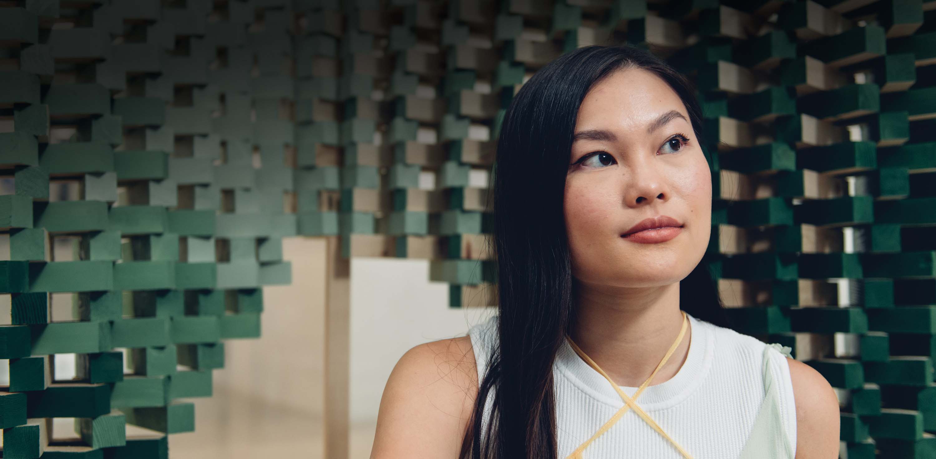 Female graduate student looking into distance