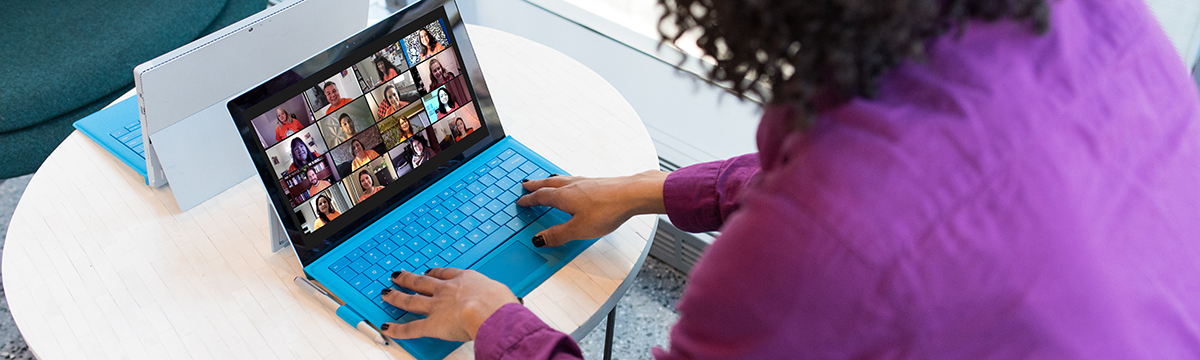 A Toronto Met student using their laptop while on a group video call.