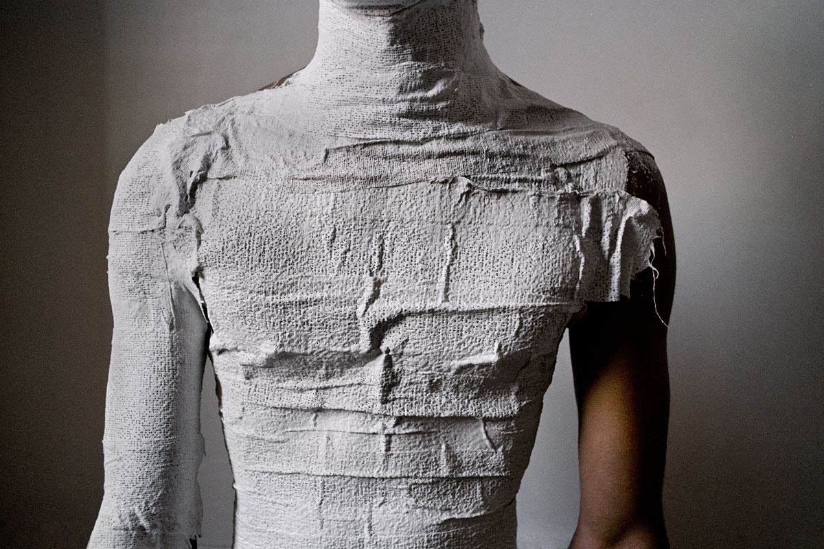 Torso of person layered with plaster, example of student photography
