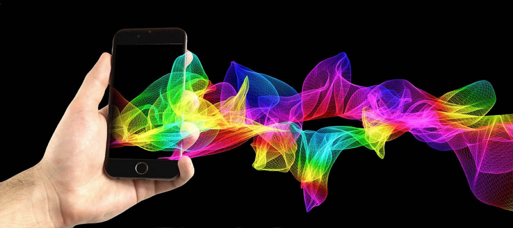 A hand holding a cellphone with rainbow coloured mesh flowing out of the screen