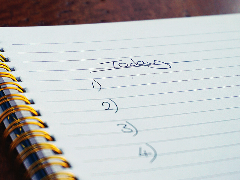 A notebook that shows a to-do list for the day.