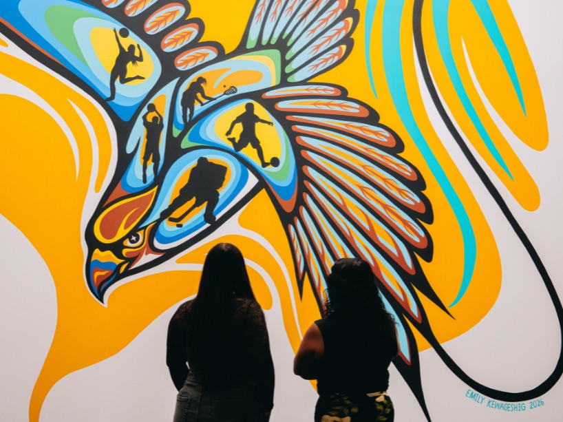 a 17’ x 17’ hand-painted mural of a falcon containing images of five different athletes.
