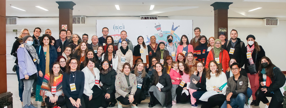 A group photo of conference attendees posing at the ISCI conference at Gramado